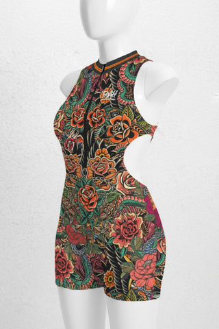 Colorful floral dress on a mannequin against a white background
