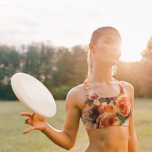 woman in the felicity pattern playing frisbee